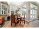 Charming dining area with natural light, hardwood floors and view of pool at 5484 Sw 30Th Ave, Ocala, FL 34471