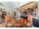 Elegant dining area, with hardwood floors, flows to the kitchen and living area at 5484 Sw 30Th Ave, Ocala, FL 34471