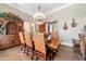 Charming dining room with ornate wood furnishings, a chandelier, and hardwood flooring at 5484 Sw 30Th Ave, Ocala, FL 34471