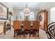 Sophisticated dining room featuring hardwood floors, custom cabinetry, and a chandelier at 5484 Sw 30Th Ave, Ocala, FL 34471