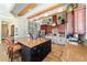 Well-designed kitchen with center island, stone accents, and wood beam ceiling at 5484 Sw 30Th Ave, Ocala, FL 34471