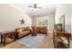 Bright living room featuring leather seating, hardwood floors, and lots of natural light at 5484 Sw 30Th Ave, Ocala, FL 34471
