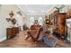 Spacious living room with hardwood floors, comfortable seating, stylish decor, and lots of natural light at 5484 Sw 30Th Ave, Ocala, FL 34471