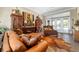 Cozy living room featuring hardwood floors, comfortable seating, stylish decor, and access to outdoor spaces at 5484 Sw 30Th Ave, Ocala, FL 34471