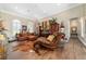 Relaxing living room with hardwood floors, cozy seating, stylish decor, and ample natural light for a comfortable atmosphere at 5484 Sw 30Th Ave, Ocala, FL 34471