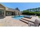 Backyard pool with a hot tub and view of a neutral colored single-story home at 5484 Sw 30Th Ave, Ocala, FL 34471