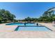 Beautiful backyard pool with hot tub and tranquil waterfall feature, surrounded by lush landscaping at 5484 Sw 30Th Ave, Ocala, FL 34471