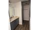 Bathroom featuring a vanity with a single sink, and a closet at 571 Midway Trak # J202, Ocala, FL 34472