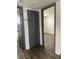 Hallway with closet and view to living room and bathroom at 571 Midway Trak # J202, Ocala, FL 34472