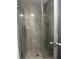 Newly renovated tiled shower with glass door at 571 Midway Trak # J202, Ocala, FL 34472