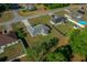 Aerial view of a home with a large yard, showcasing its location in a suburban neighborhood at 5899 Pecan Rd, Ocala, FL 34472