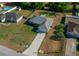 Inviting single-story home featuring a long driveway and well-maintained lawn in a quiet residential neighborhood at 5899 Pecan Rd, Ocala, FL 34472