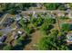 Quiet residential street featuring well-maintained homes with mature trees and green lawns at 5899 Pecan Rd, Ocala, FL 34472