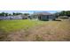 Expansive backyard featuring green grass, offering plenty of space for outdoor activities and relaxation at 5899 Pecan Rd, Ocala, FL 34472
