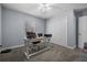 Bedroom featuring a ceiling fan, desk, and spacious closet at 5899 Pecan Rd, Ocala, FL 34472