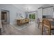 Dining area featuring a wood table with seating for six, open to the kitchen at 5899 Pecan Rd, Ocala, FL 34472