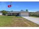 Charming single-story home with well-maintained lawn and driveway at 5899 Pecan Rd, Ocala, FL 34472