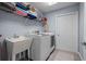 Laundry room featuring a utility sink and washer/dryer at 5899 Pecan Rd, Ocala, FL 34472