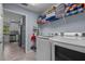 Laundry room leading to a view of the kitchen at 5899 Pecan Rd, Ocala, FL 34472