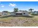 Exterior of the home highlighting back yard at 614 Third Ave, Lady Lake, FL 32159