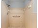 Bathroom features tiled shower stall with shower head and grab bar at 614 Third Ave, Lady Lake, FL 32159