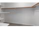 Walk-in closet with white shelving and clothing rod at 614 Third Ave, Lady Lake, FL 32159