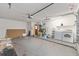 Spacious garage with washer, dryer, and storage at 614 Third Ave, Lady Lake, FL 32159