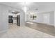 Modern kitchen with granite countertops, stainless steel appliances, and a seamless transition to the living area at 614 Third Ave, Lady Lake, FL 32159