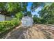 A utility shed in the backyard provides extra storage space at 614 Third Ave, Lady Lake, FL 32159