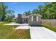 View of the backyard featuring a spacious patio perfect for outdoor entertaining, a lush lawn, and a shed at 6318 Nw 52Nd Ave, Ocala, FL 34482