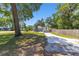 View of the backyard featuring a spacious patio perfect for outdoor entertaining, a lush lawn, and a shed at 6318 Nw 52Nd Ave, Ocala, FL 34482