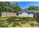 Backyard featuring a shed and partial privacy fence at 6318 Nw 52Nd Ave, Ocala, FL 34482