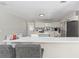 Kitchen featuring an island, stainless steel appliances, and quartz counters at 6318 Nw 52Nd Ave, Ocala, FL 34482