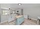 Bright kitchen with an island, breakfast bar, and stainless steel appliances at 6318 Nw 52Nd Ave, Ocala, FL 34482