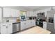 Updated kitchen with stainless steel appliances and white cabinetry at 6318 Nw 52Nd Ave, Ocala, FL 34482