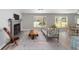 Open living space featuring natural light, fireplace and eclectic decor at 6318 Nw 52Nd Ave, Ocala, FL 34482