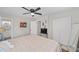 Bright bedroom features a mirrored closet, ensuite bath and a TV at 6318 Nw 52Nd Ave, Ocala, FL 34482