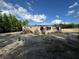 Backyard area featuring a grassy ground and a home exterior in the background at 6658 Sw 165Th Ct, Ocala, FL 34481