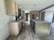 Spacious kitchen featuring modern cabinets, stainless steel appliances, and a kitchen island at 6658 Sw 165Th Ct, Ocala, FL 34481