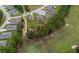 Aerial view of homes backing onto a golf course in a well-maintained community with mature trees at 716 Hickory Course Loop, Ocala, FL 34472