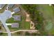 Aerial view of homes backing onto a golf course in a lovely neighborhood with walkable paved paths at 716 Hickory Course Loop, Ocala, FL 34472