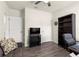 Comfortable bedroom showing a couch, desk, and ample closet space at 716 Hickory Course Loop, Ocala, FL 34472