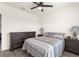 Comfortable bedroom with ceiling fan, wood-look flooring, and stylish furnishings at 716 Hickory Course Loop, Ocala, FL 34472