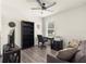 Cozy bedroom featuring a desk, bookcase, and comfortable seating area at 716 Hickory Course Loop, Ocala, FL 34472