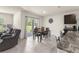 Dining area with table and chairs, next to the living room, and sliding glass door at 716 Hickory Course Loop, Ocala, FL 34472