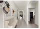 Bright hallway with arched doorways, tile floors, and decorative accents at 716 Hickory Course Loop, Ocala, FL 34472