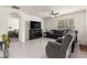 Bright living room has neutral paint, large windows, and views into an adjacent bedroom for a spacious feel at 716 Hickory Course Loop, Ocala, FL 34472
