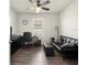 Bright office space featuring wood floors, a fan, and a black leather couch for comfortable work at 716 Hickory Course Loop, Ocala, FL 34472