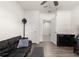 Bright office space featuring wood floors, a fan, and a black leather couch for comfortable work at 716 Hickory Course Loop, Ocala, FL 34472