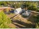 The aerial view displays the home next to the church, and the home's large grass filled yard at 721 Ne 2Nd St, Ocala, FL 34470